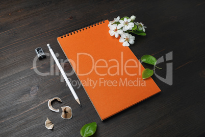 Notebook, pencil, sharpener, flowers