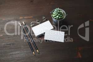 Business cards, pencils, plant