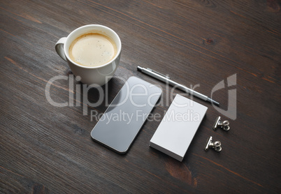 Smartphone, coffee, business card, pen
