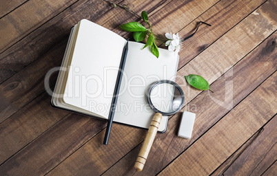 Notebook, magnifier, pencil, eraser