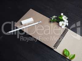Kraft notebook, pencil, eraser, flowers