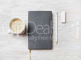 Notebook, coffee cup, pencil, eraser