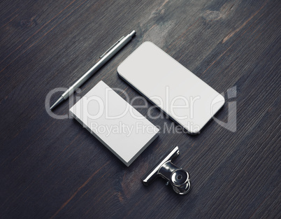 Business card, smartphone, pen