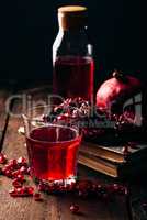 Glass of infusion with fpomegranate juice