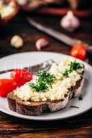 Toast with processed cheese, garlic and dill