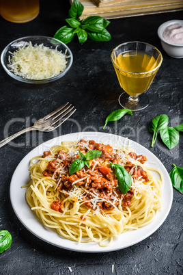 Spaghetti with bolognese sauce, parmesan and basil