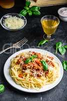Spaghetti with bolognese sauce, parmesan and basil