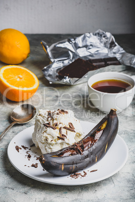 Grilled banana with dark chocolate and vanilla ice cream.