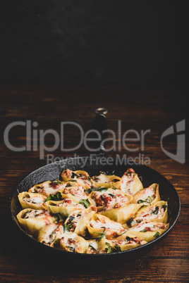 Skillet of stuffed jumbo shells pasta