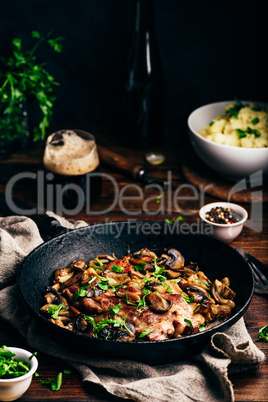 Fried pork neck steak with different mushrooms