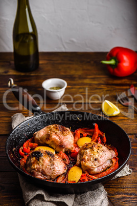 Chicken thighs with red bell peppers and lemon