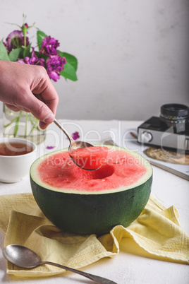 The Spoon with Piece of Watermelon in Hand