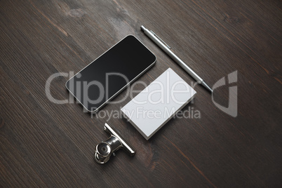 Smartphone, business card, pen