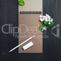 Notepad, pencil, eraser, flowers