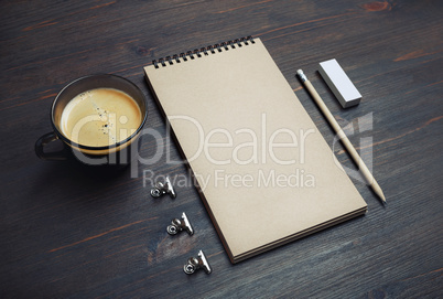 Notebook, coffee cup, pencil, eraser