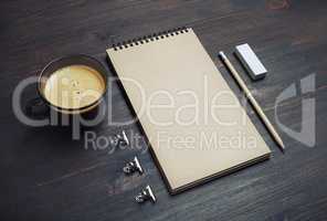 Notebook, coffee cup, pencil, eraser