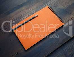 Orange sketchbook, pencil