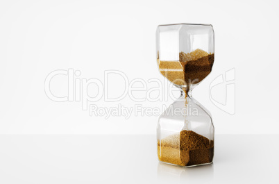 Hourglass on light background