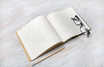 Book, glasses, pencil