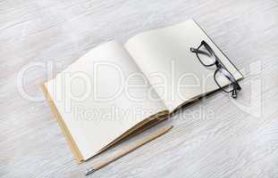 Book, glasses, pencil