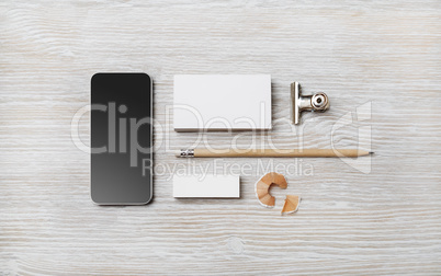 Business card, smartphone, pencil, eraser