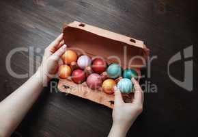 Easter eggs and female hands