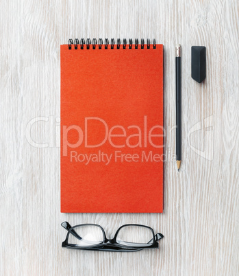 Notepad, glasses, pencil, eraser