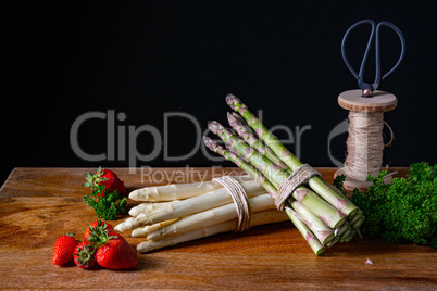 Green and white asparagus on the table