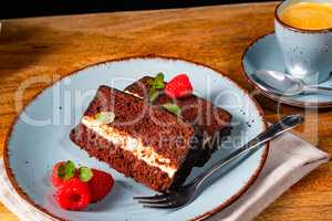Rustic chocolate cake with raspberries and coffee