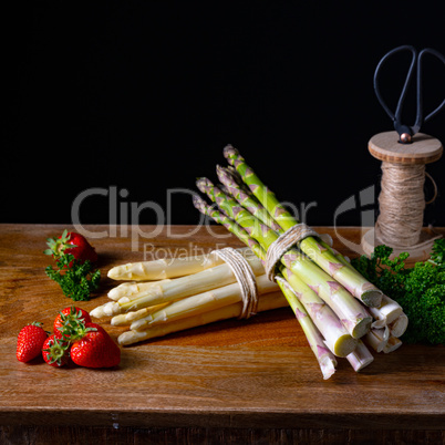 Green and white asparagus on the table