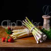 Green and white asparagus on the table