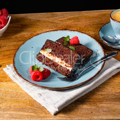 Rustic chocolate cake with raspberries and coffee