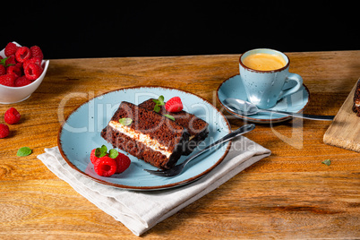 Rustic chocolate cake with raspberries and coffee