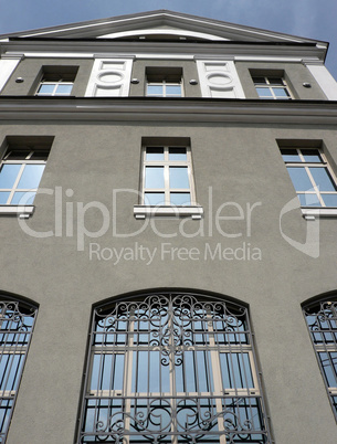 windows of building with grid at day