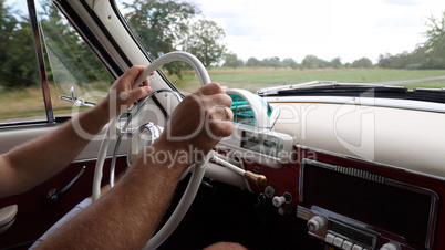 In the cockpit of a vintage car