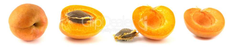 4 whole apricots and halves with stones isolated on white background close up. Set of four fruits.