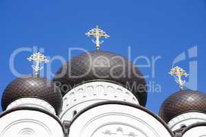 Beautiful dome of the church on a background of blue cloudless sky on a sunny day