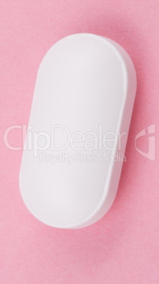 White Pill on Pink Background