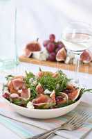 Salad with cheese, arugula with ham