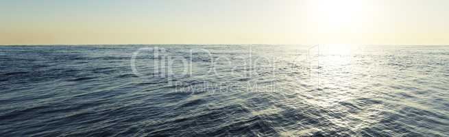 Wide ocean with a sunrise, space for text or image, travel conce
