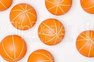 Many basketballs ona bright background