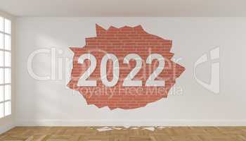Room with crumbling plaster on the wall and the year 2022