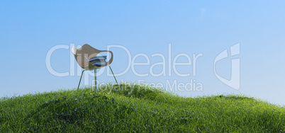 Pile of books on a small grassy hill