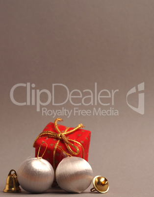 Silver vintage Christmas baubles on a grey background with space