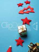 Christmas decoration as frame on a blue paper background