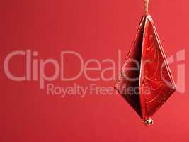 Christmas tree decorations folded from beautiful red and gold de