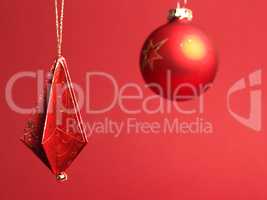 Christmas tree decorations folded from beautiful red and gold de