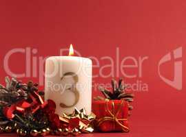 White candle with the number three burns, Advent background