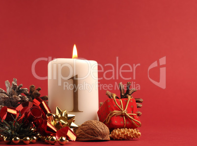 White candle with the number one burns, Advent background