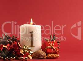 White candle with the number one burns, Advent background
